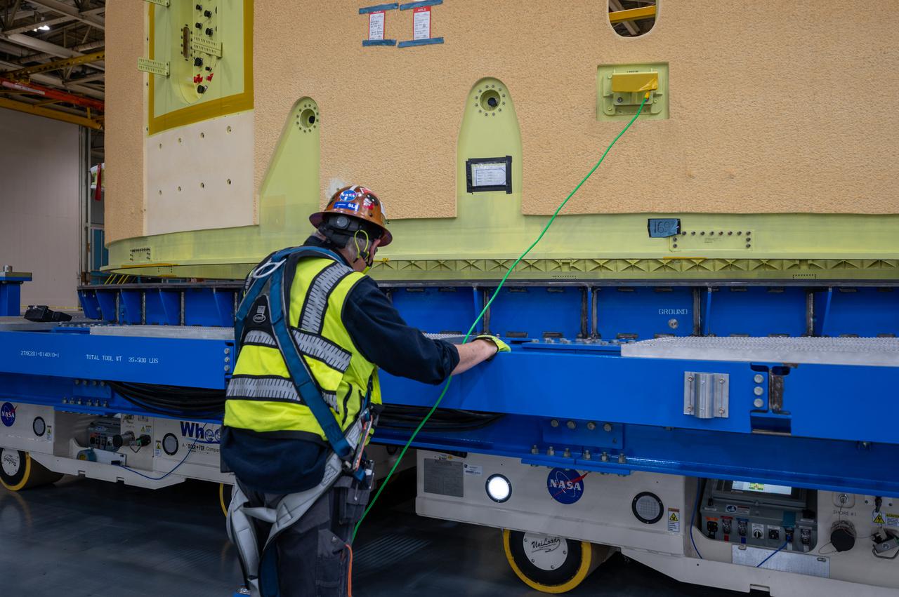 This image shows the forward skirt that will be used on the core stage of NASA’s Space Launch System rocket for Artemis II, the first crewed mission of NASA’s Artemis program, at NASA’s Michoud Assembly Facility. The SLS core stage is made up of five unique elements: the forward skirt, liquid oxygen tank, intertank, liquid hydrogen tank, and the engine section. The forward skirt houses flight computers, cameras, and avionics systems. The hardware is located at the top of the 212-foot-tall core stage and connects the upper part of the rocket to the core stage. Soon, technicians will ready the forward skirt for the first of three core stage assembly mates called the forward join. The forward join consists of three main parts -- the forward skirt, liquid oxygen tank, and intertank – to create the top, or forward part, of the core stage.  Together with its four RS-25 engines, the rocket’s massive 212-foot-tall core stage — the largest stage NASA has ever built — and its twin solid rocket boosters will produce 8.8 million pounds of thrust to send NASA’s Orion spacecraft, astronauts and supplies beyond Earth’s orbit to the Moon and, ultimately, Mars. Offering more payload mass, volume capability and energy to speed missions through space, the SLS rocket, along with NASA’s Gateway in lunar orbit, the Human Landing System, and Orion spacecraft, is part of NASA’s backbone for deep space exploration and the Artemis lunar program. No other rocket is capable of carrying astronauts in Orion around the Moon in a single mission.